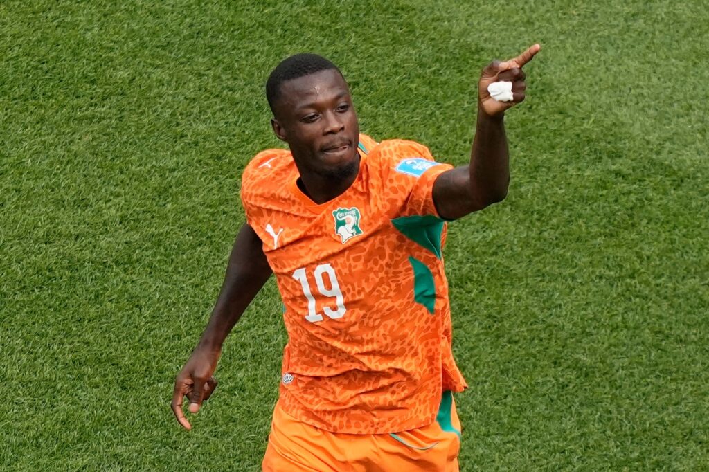 Ivory Coast's Nicolas Pepe (19) celebrates after scoring the opening goal during the World Cup Group E soccer match