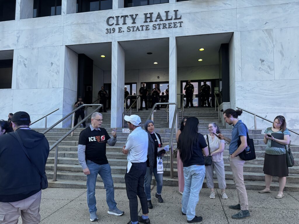 Police officers standing outside of Trenton City Hall