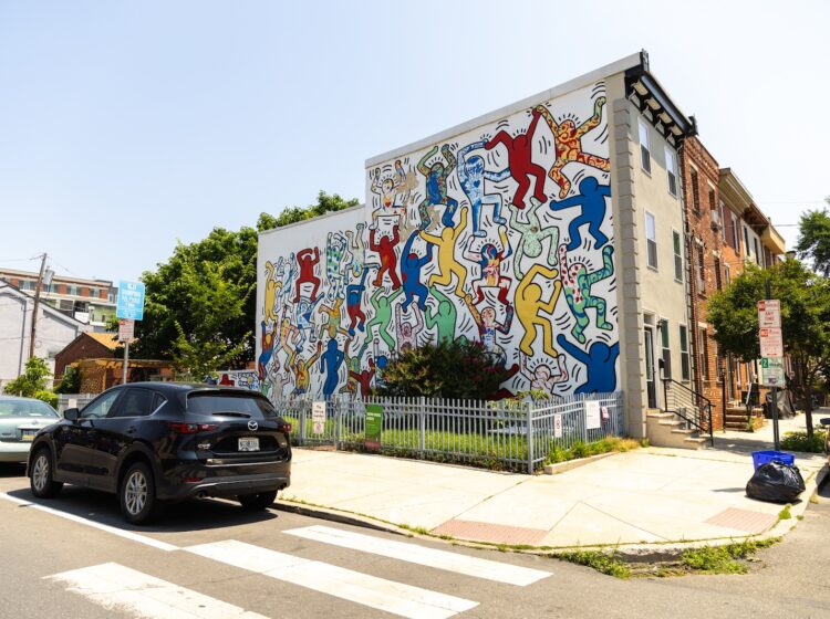 The ''We the Youth'' mural by artist Keith Haring, installed in 1987, as seen from 22nd and Ellsworth streets in South Philadelphia's Point Breeze neighborhood. (Kimberly Paynter/WHYY)
