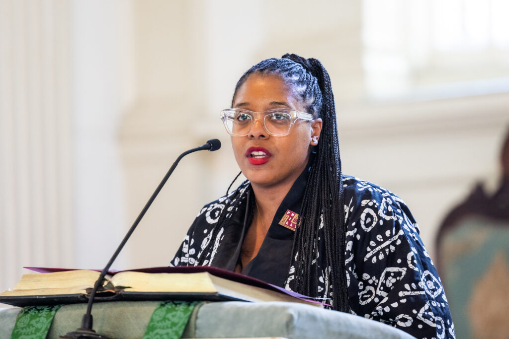 Rev. Carolyn Clarence Cavaness speaking at a podium at the church