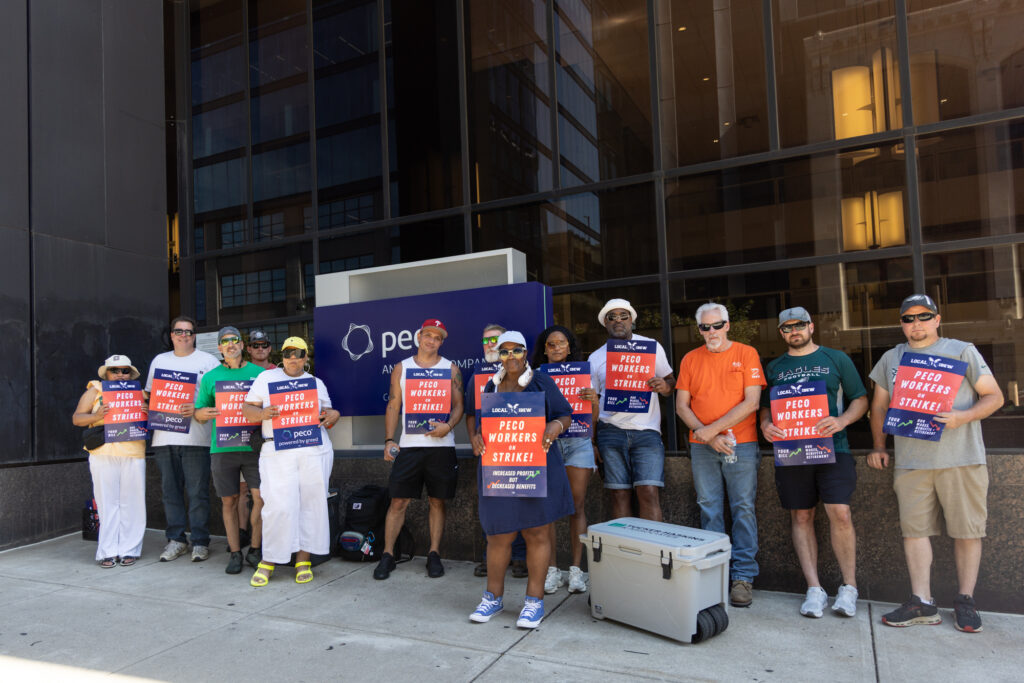 Striking PECO workers picket outside the company headquarters