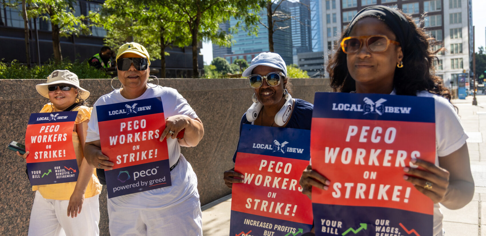 Striking PECO workers picket outside the company headquarters