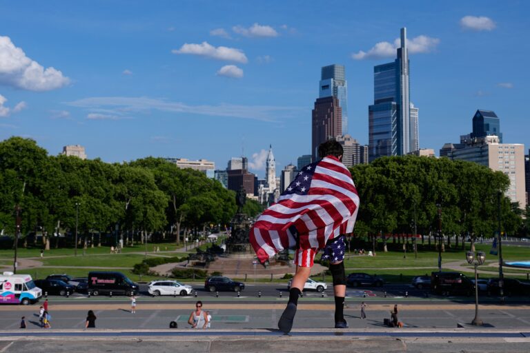 A young fan with US flag walks down the Rocky Steps during the the 2026 FIFA World Cup in Philadelphia, Friday, June 12, 2026. (AP Photo/Petr David Josek)