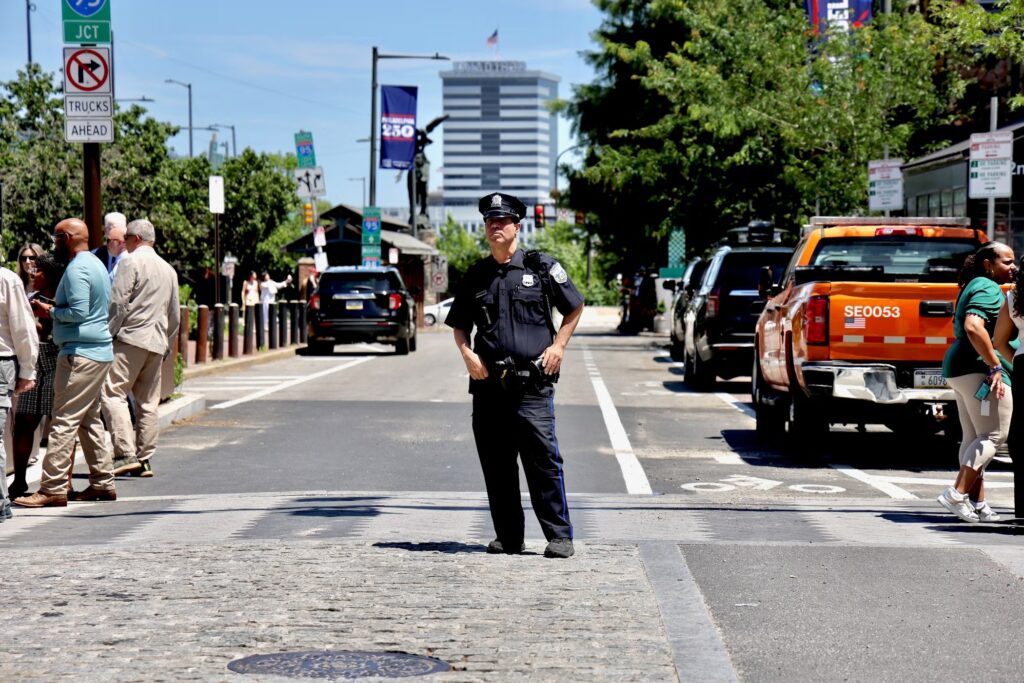 2026-06-09-e-lee-philadelphia-market-and-2nd-traffic-police-file A Philadelphia police officer directs traffic at 2nd and Market streets.