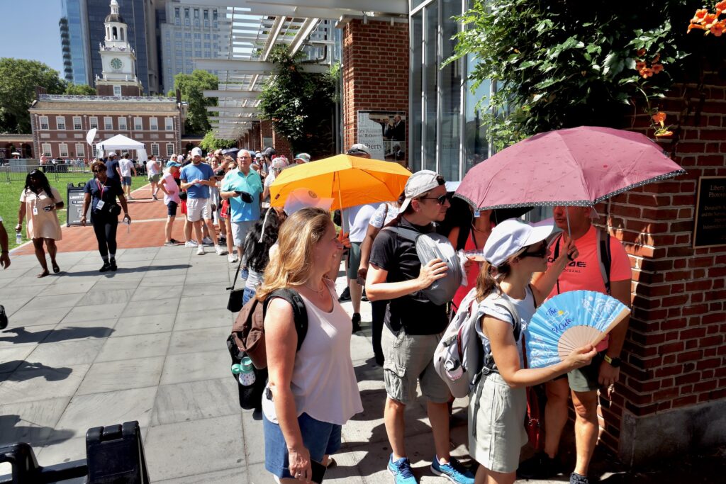 Visitors wait in line on Independence Mall to see the Liberty Bell on Thursday, July 2, 2026.