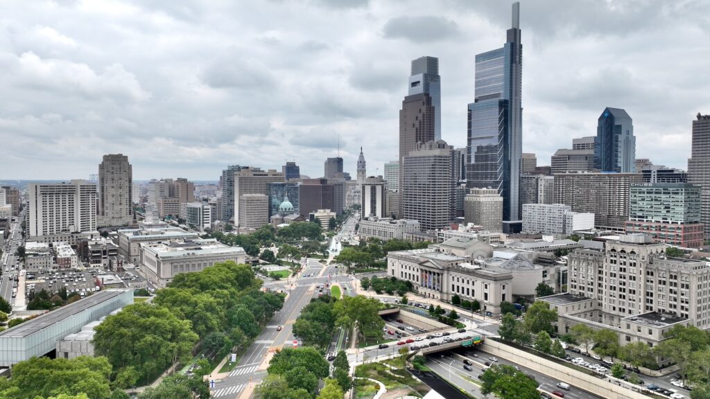 2026 07 21-e lee-philadelphia ben franklin parkway 676 to city hall Aerial photo of the Philly skyline looking down the Parkway toward City Hall.