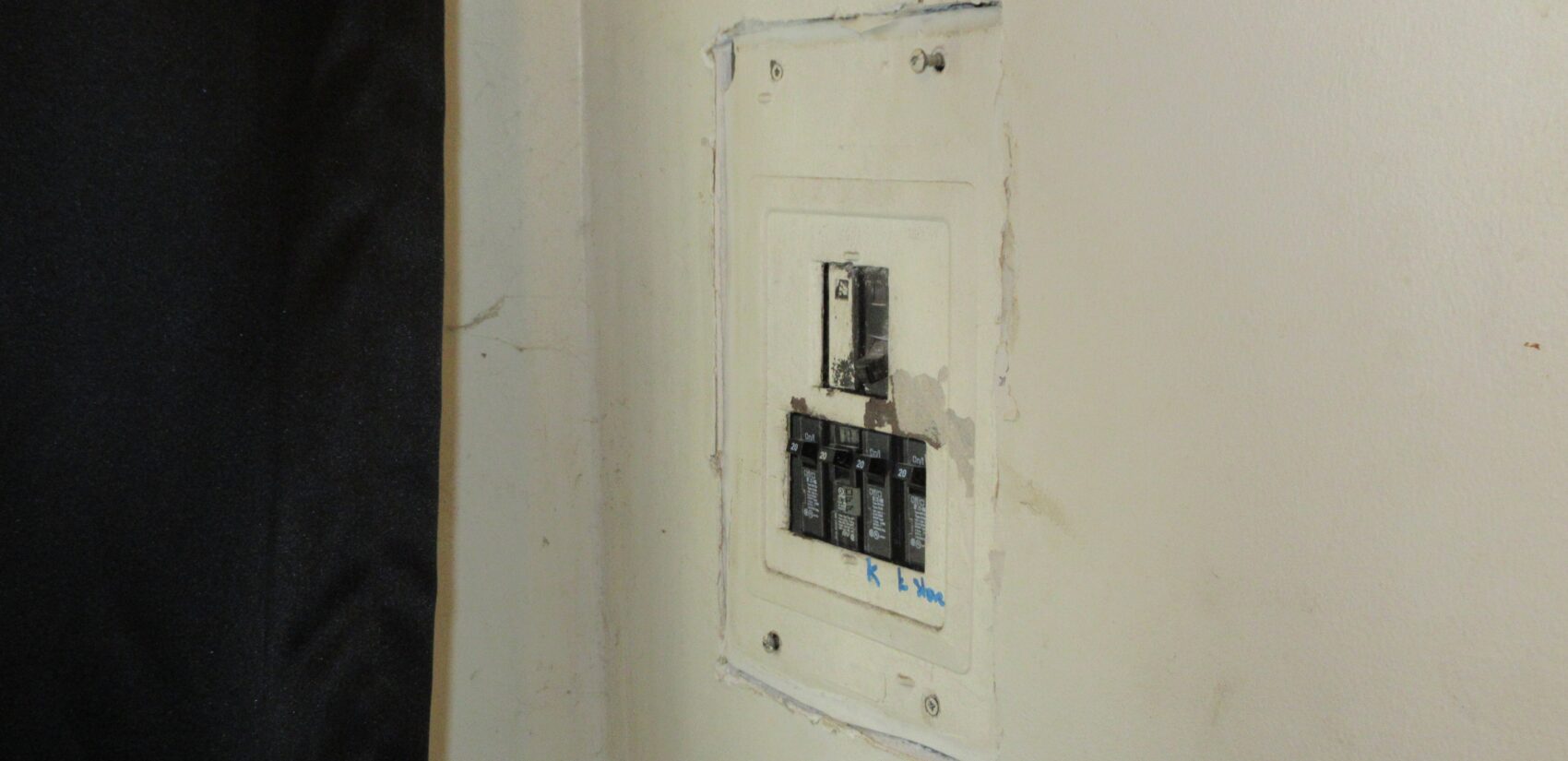 An exposed electric breaker box