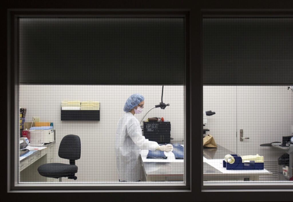 Allyson Goble In this Friday, March 2, 2012 photo, Allyson Goble, a forensic scientist at the New York State Police Forensic Investigation Center in Albany, N.Y., screens a pair of blue jeans for biological evidence.