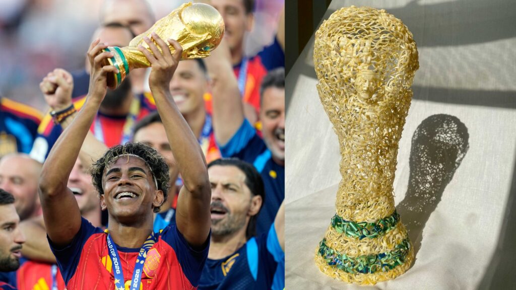 Spain's Lamine Yamal celebrates with the trophy