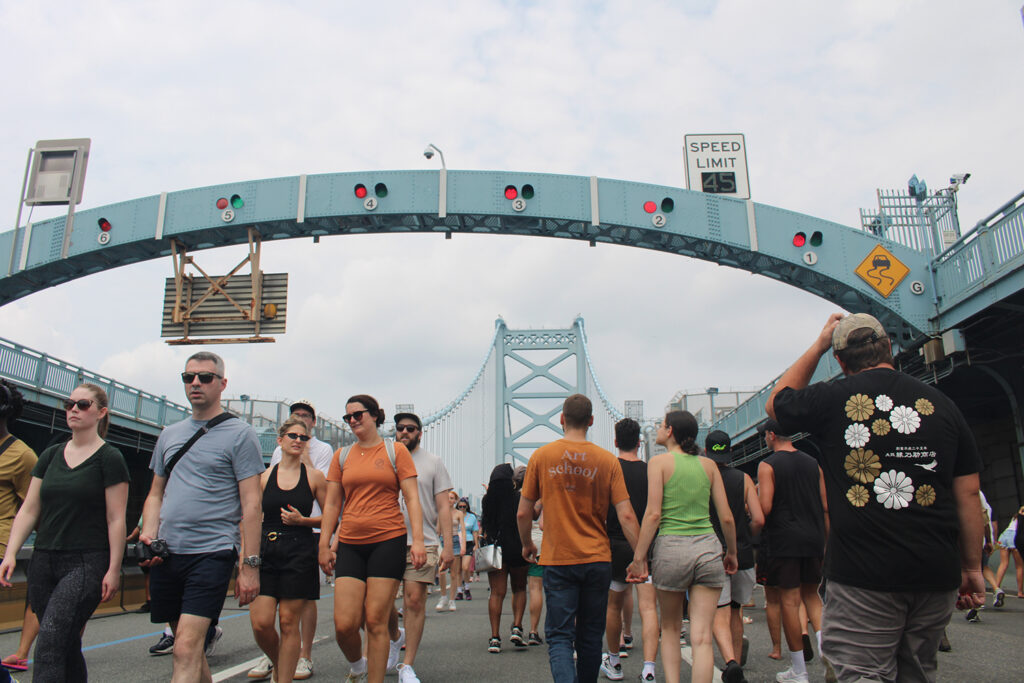 ben-franklin-bridge-100-13 People walk across the Ben Franklin Bridge