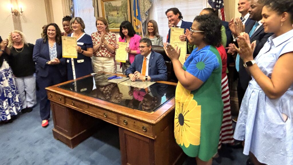 Delaware Gov. Matt Meyer and state lawmakers celebrate the signing of the fiscal year 2027 operating budget on June 30.