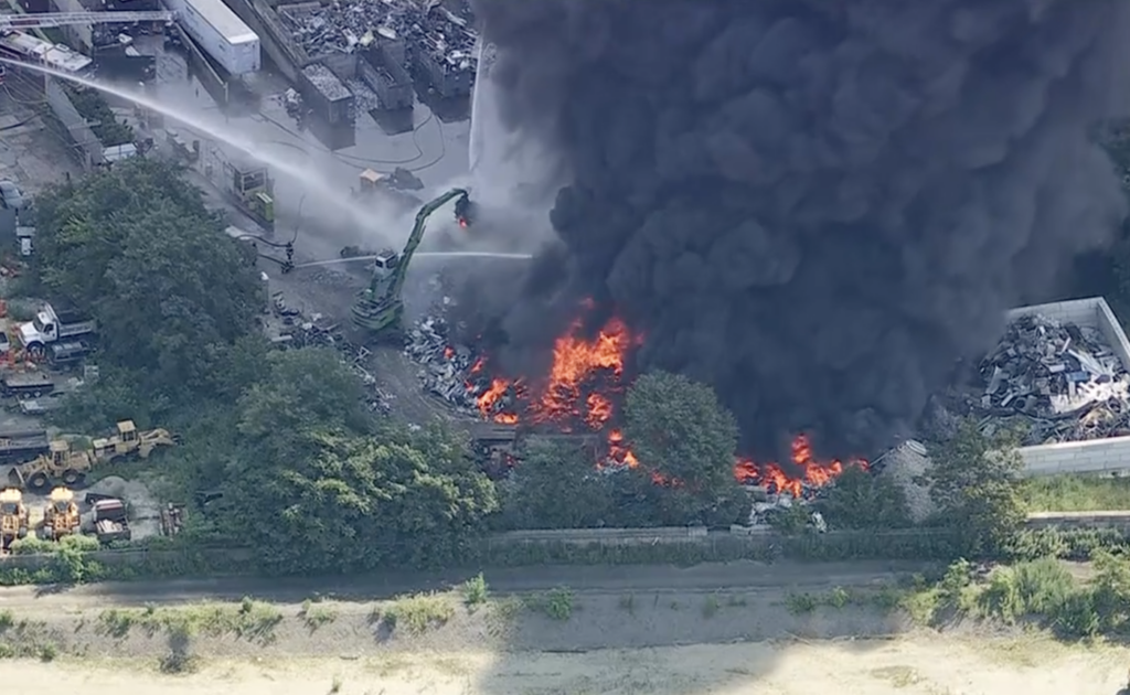 delco-fire-abc-2026-07-15-2 firefighters spraying water onto the large fire.