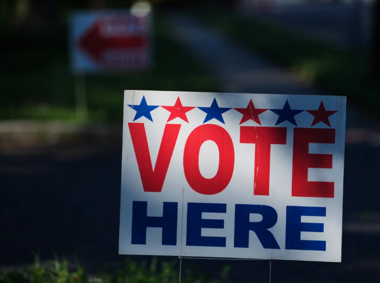 A ''Vote Here'' sign on a lawn directs voters to a polling place for an election on June 2, 2026.