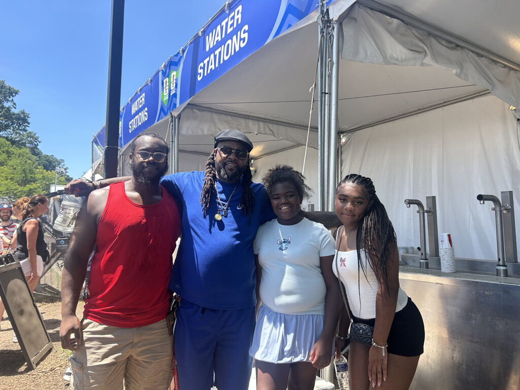 fan-fest-philadelphia-heat A family poses for a picture in from of a water station at the FIFA Fan Fest in Philadelphia