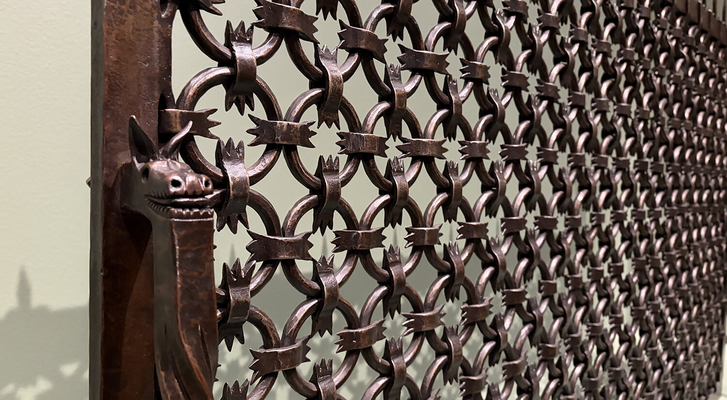 A close-up of a wrought iron fire screen