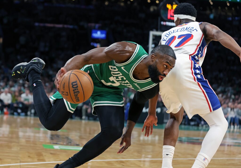 Boston Celtics' Jaylen Brown drives past the Philadelphia 76ers' VJ Edgecombe