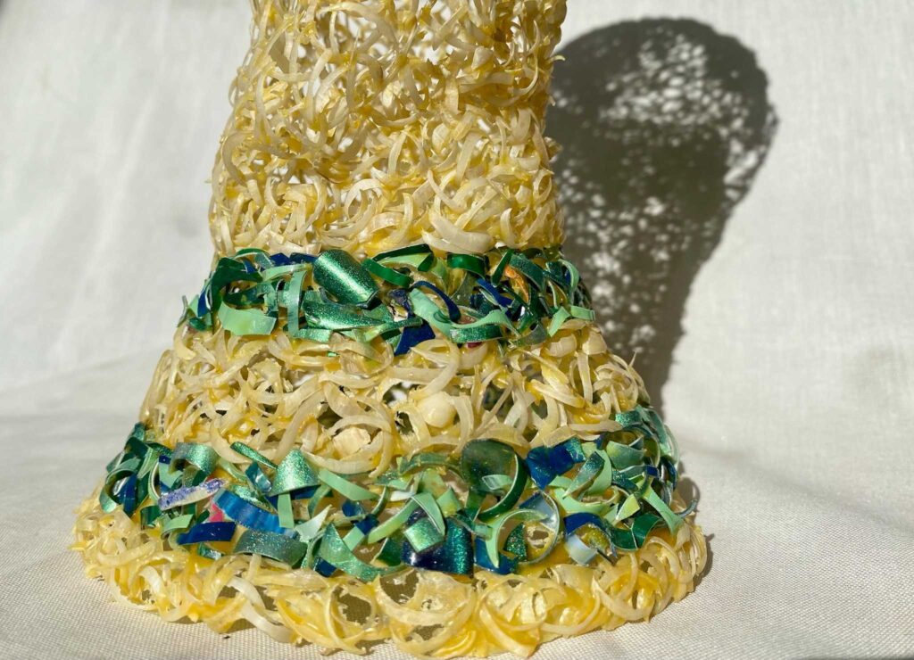 A sculpture of the World Cup trophy made out of toenails.