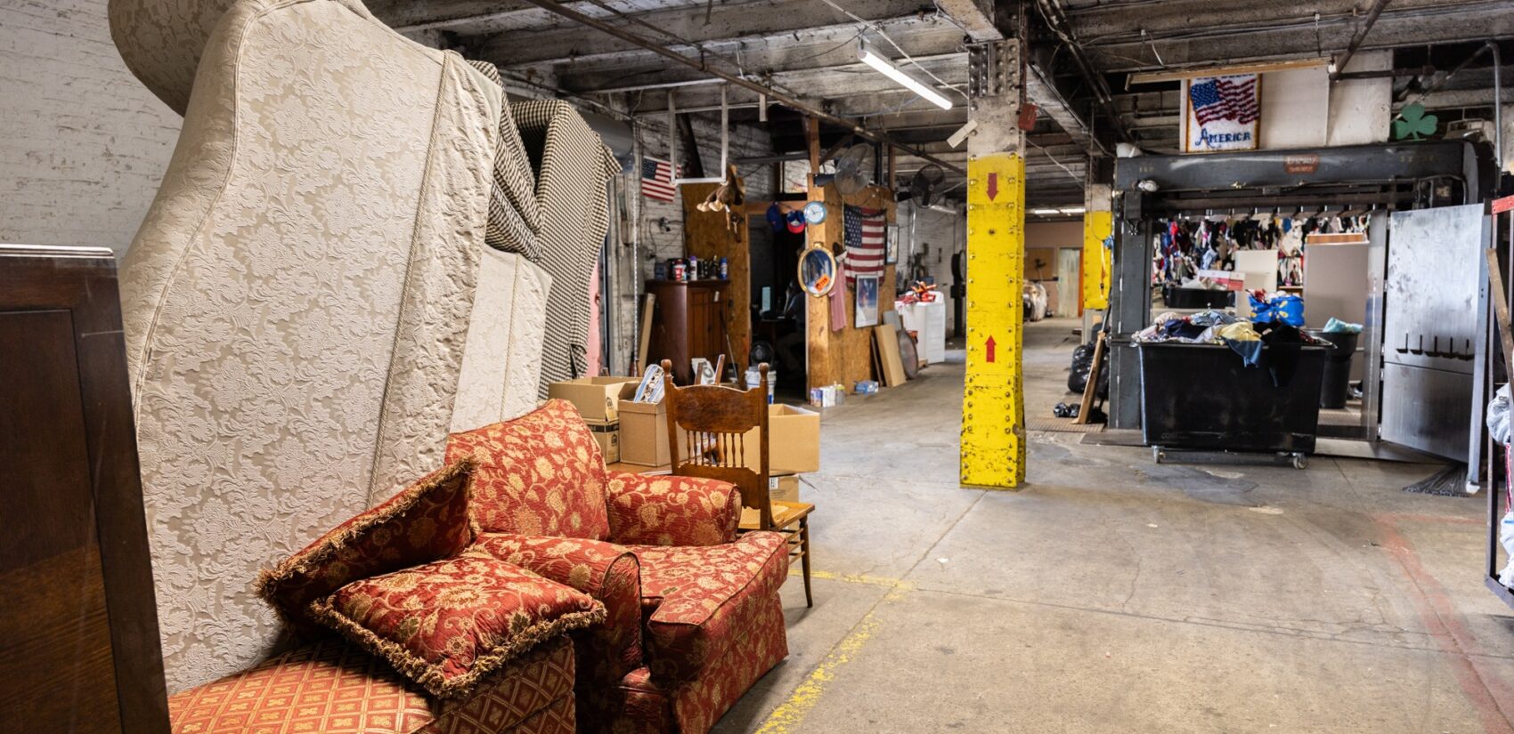 Furniture and clothing donations in a room