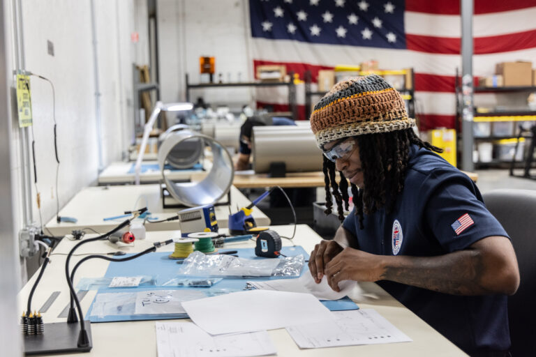 an employee at a desk at the Albacore facility