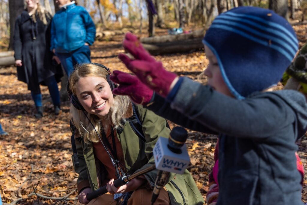 WHYY News reporter Sophia Schmidt is seen in the field at the Schuylkill Center for Environmental Education in Philadelphia.