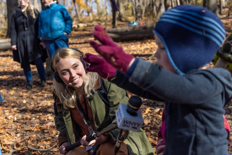 WHYY News reporter Sophia Schmidt is seen in the field at the Schuylkill Center for Environmental Education in Philadelphia.