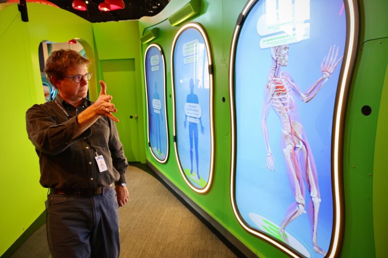 WHYY News reporter Peter Crimmins is seen in the field at The Franklin Institute in Philadelphia on Nov. 20, 2024.