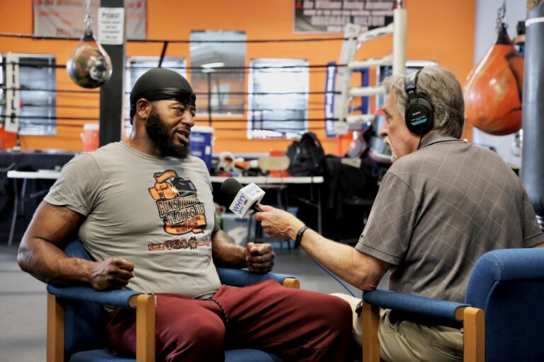 WHYY News reporter David Matthau interviews Mike Hilton, at Williams Boxing Academy in Trenton, New Jersey, on July 24, 2025.