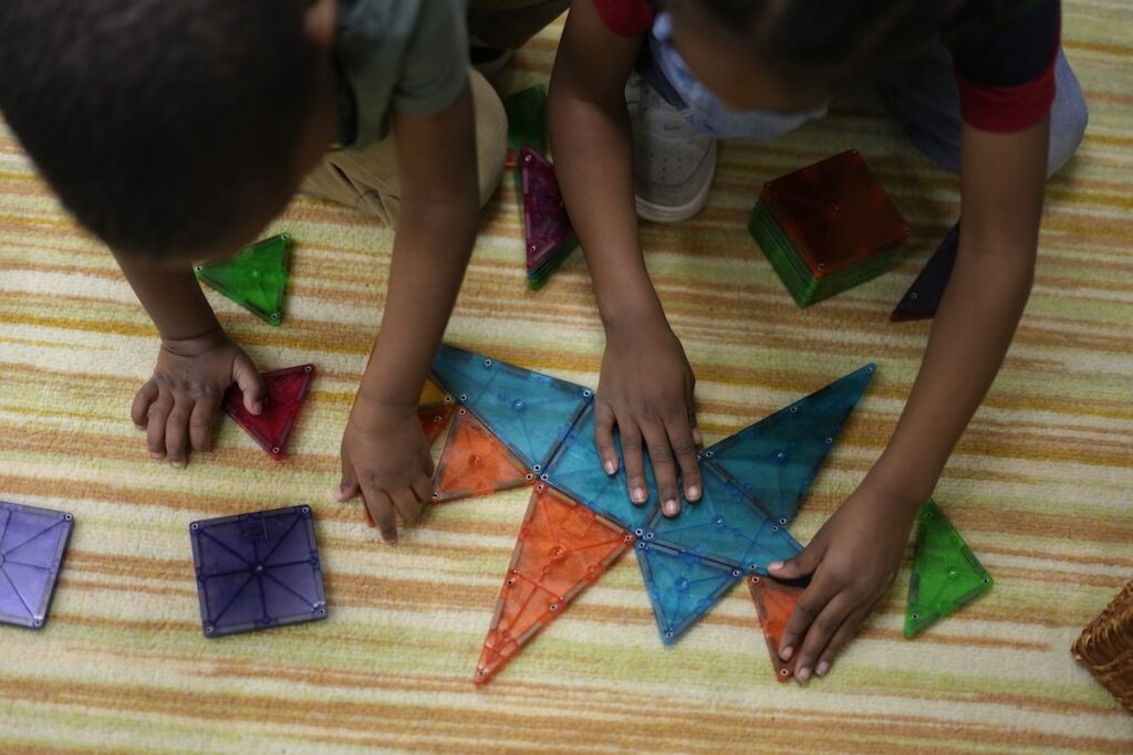 Head Start Salaries Children work on a puzzle during a preschool class at the Life Learning Center - Head Start, in Cincinnati, Tuesday, Nov. 21, 2023. A new plan from the Biden administration could significantly increase salaries for hundreds of low-paid early childhood teachers caring for the country's poorest children but might also force some centers to cut enrollment. (AP Photo/Carolyn Kaster)