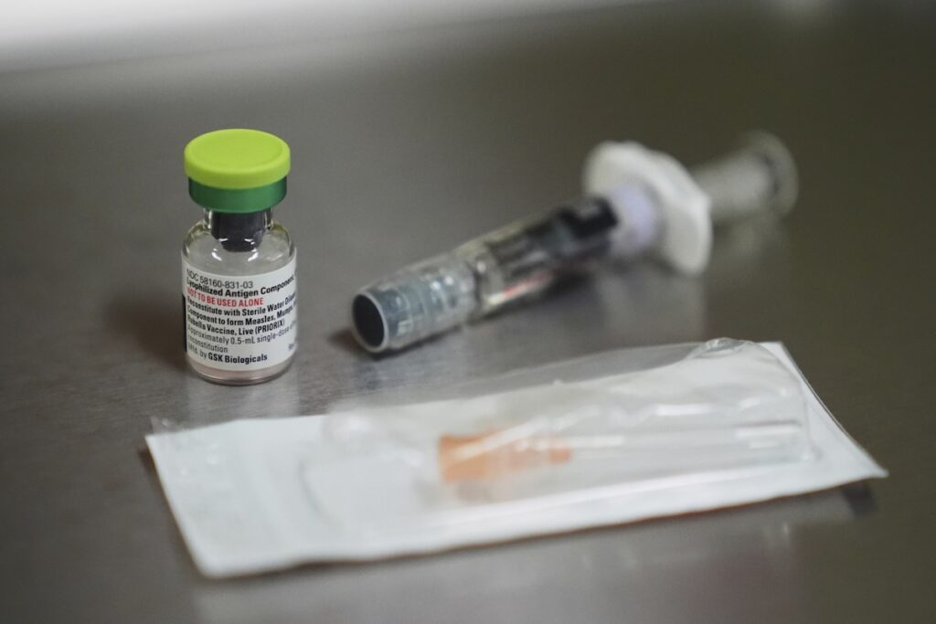 A vial of the measles, mumps and rubella (MMR) vaccine is pictured at International Community Health Services, Wednesday, Sept. 10, 2025, in Seattle. (AP Photo/Lindsey Wasson)