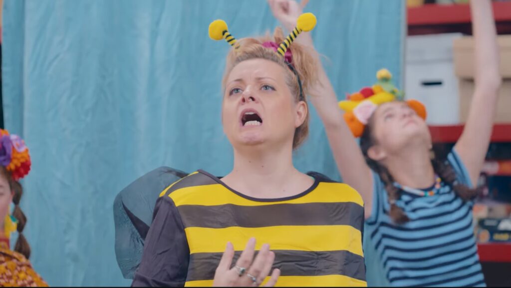 Good Neighbor Club cast member dressed in bee costume.