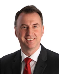 John Shulli headshot in front of a white background