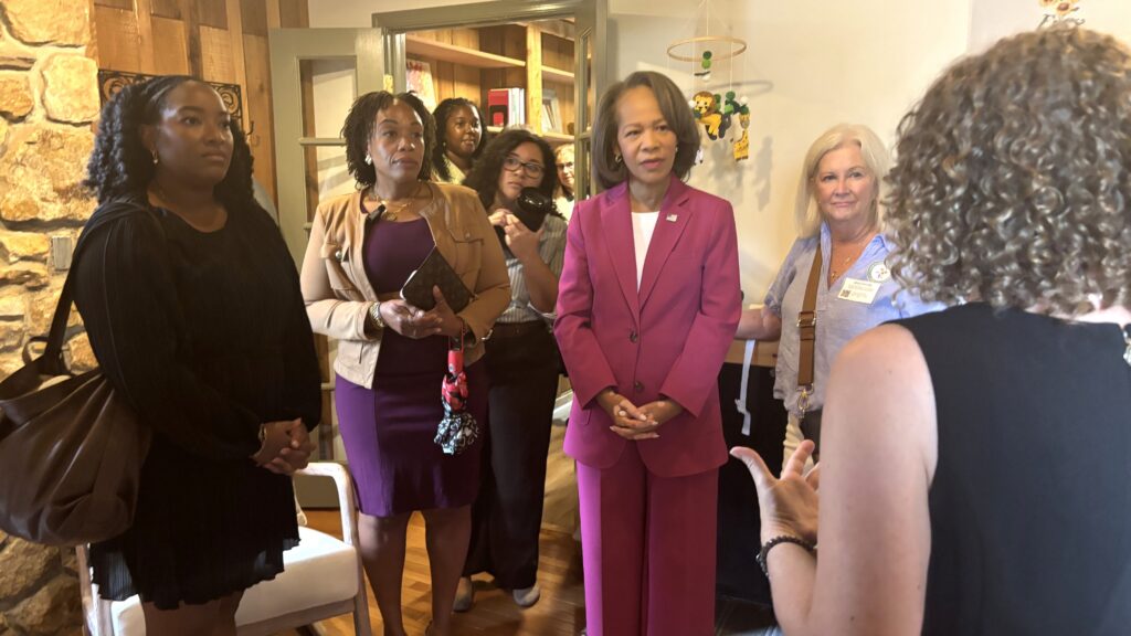 Lisa Blunt Rochester listening to a group of people