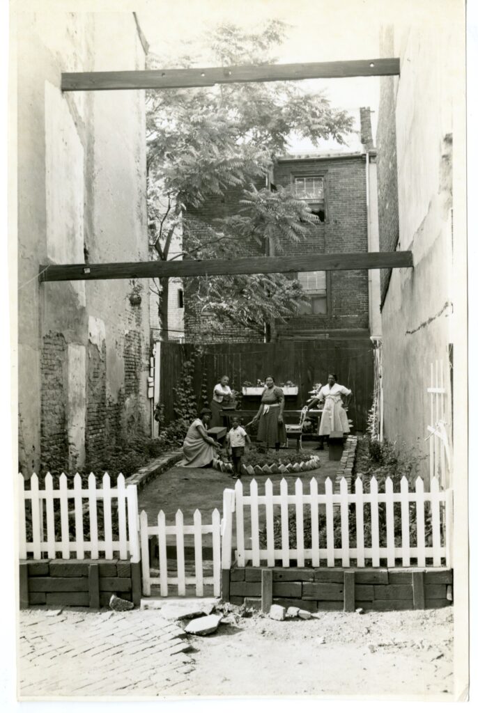 An archival still of a family outside