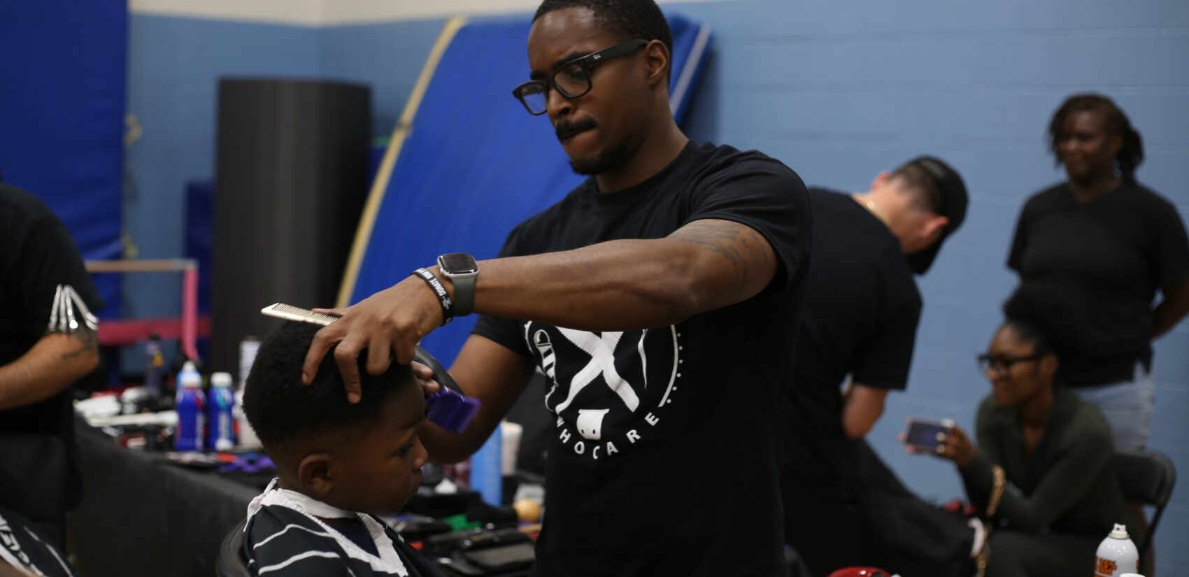 a kid receives a haircut