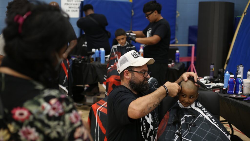 back-to-school-haircuts-philadelphia-2026-08-23-cs-6 a kid receives a haircut