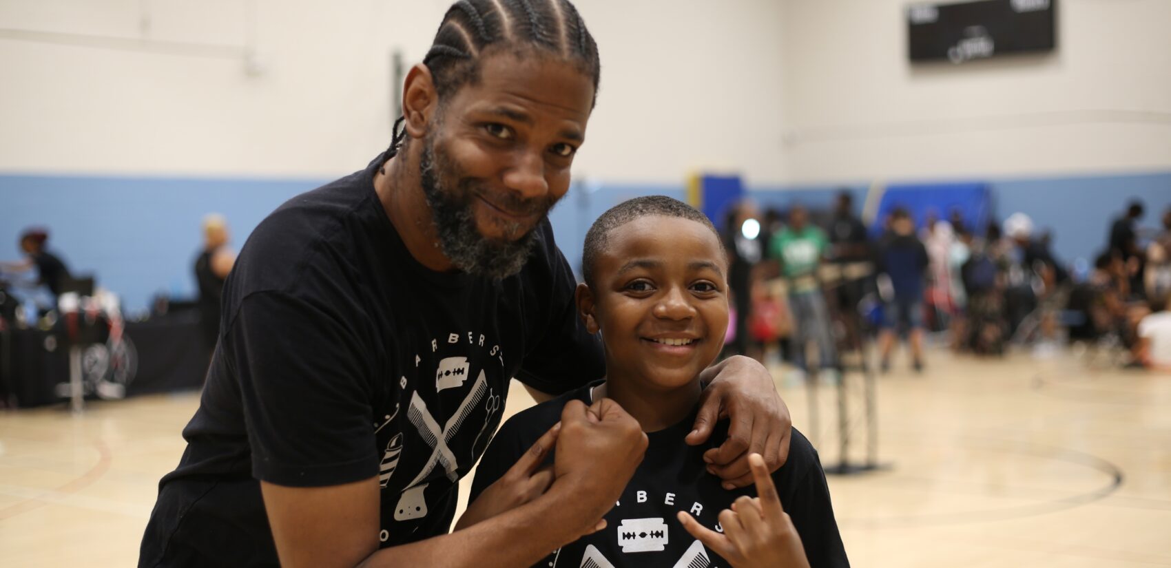 Mike Walker and a child smile for a photo
