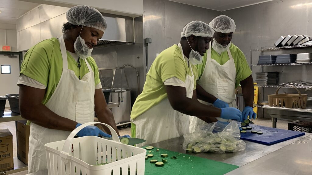 Volunteering correctional residents preparing food