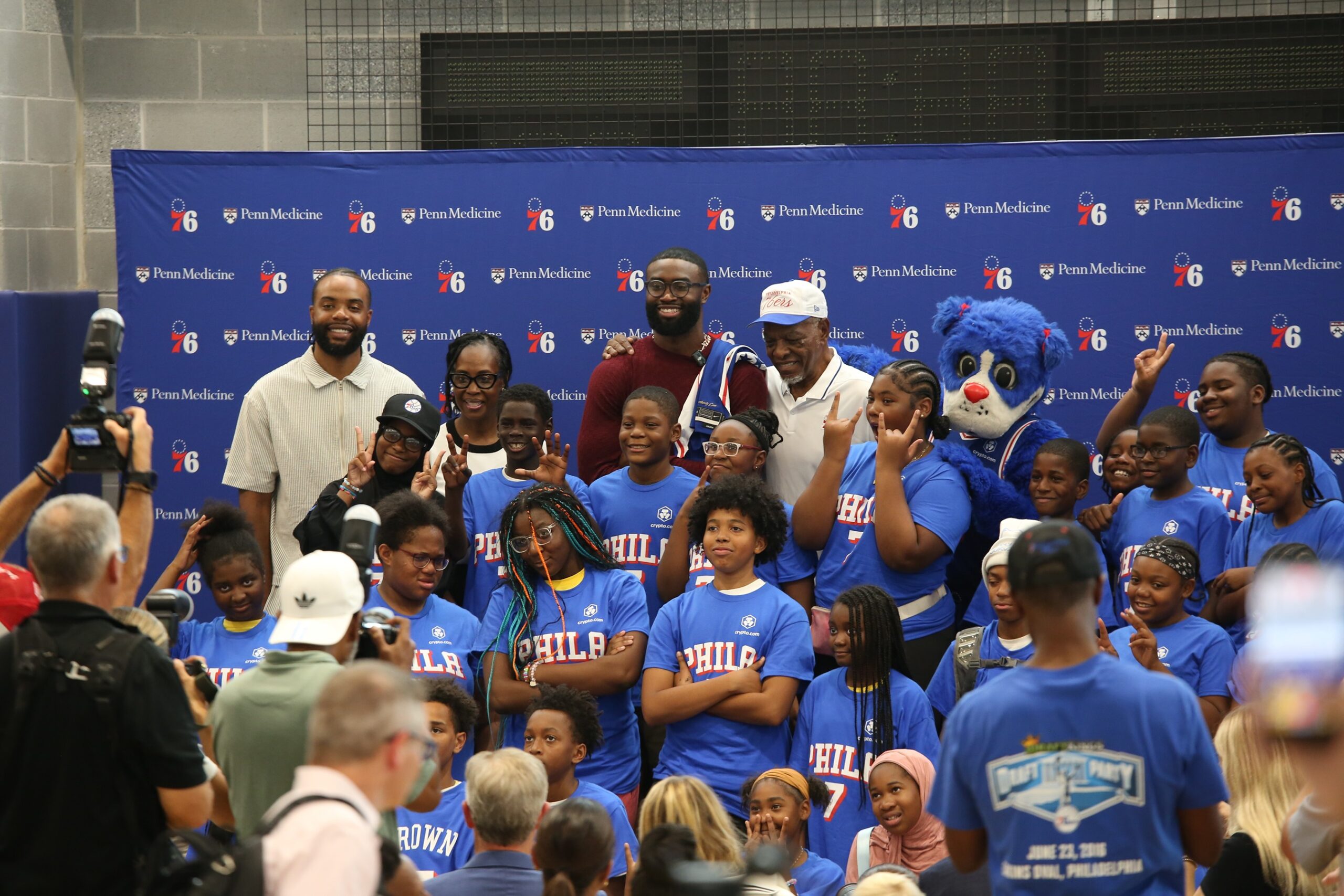 Kids taking a picture with Jaylen Brown