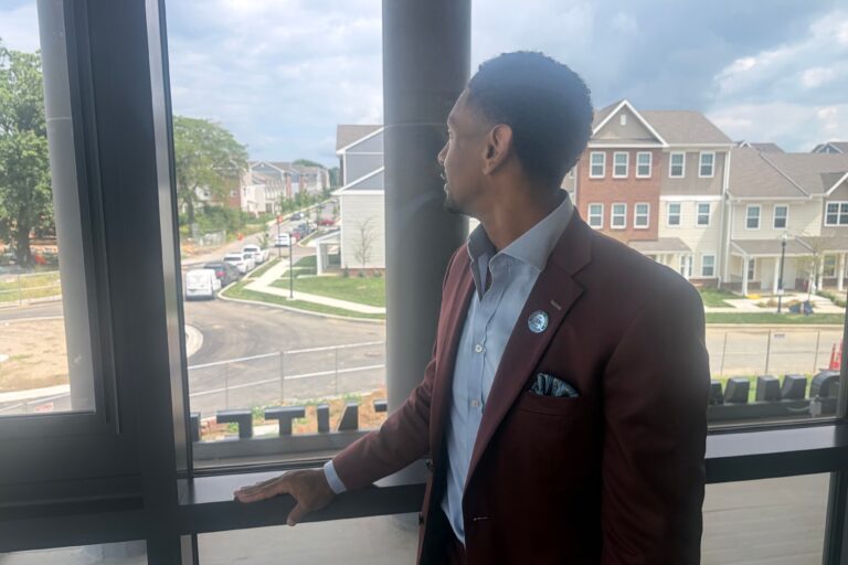 Logan Herring looks out a window
