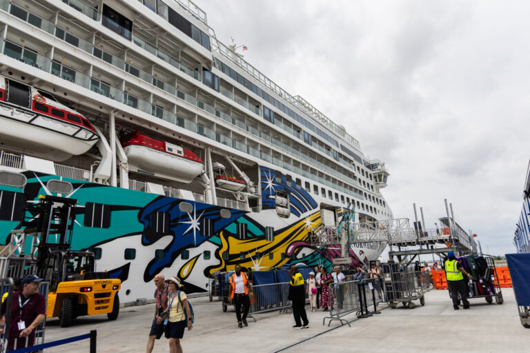 Passengers and workers in Philadelphia get ready to depart on the Norwegian Jewel cruise liner