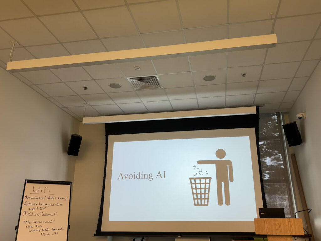 philadelphia-library-avoiding-ai-workshop copy A projector shows a slide that reads
