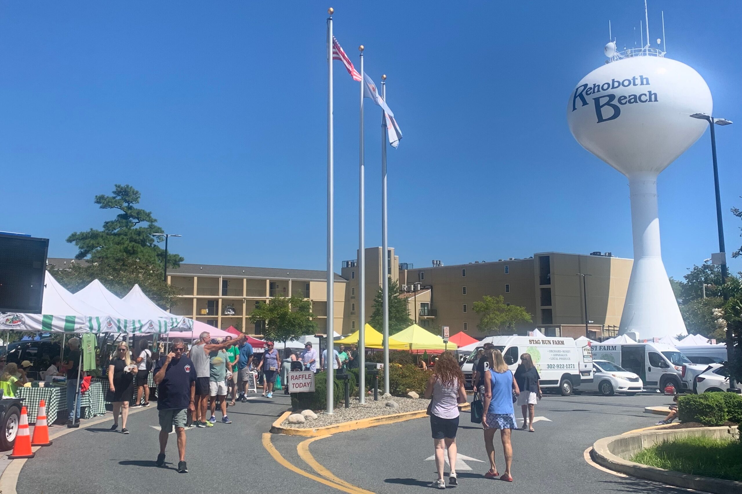 people walk through the Convention Center Parking Lot