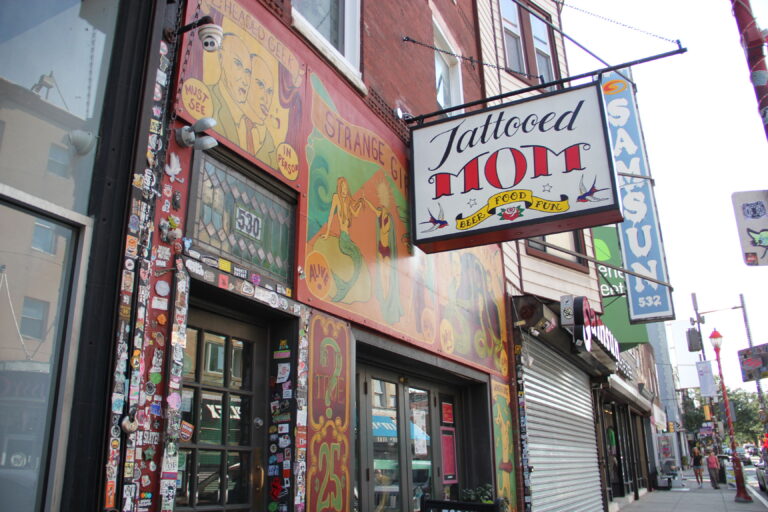 the outdoor sign for the Tattooed Mom bar