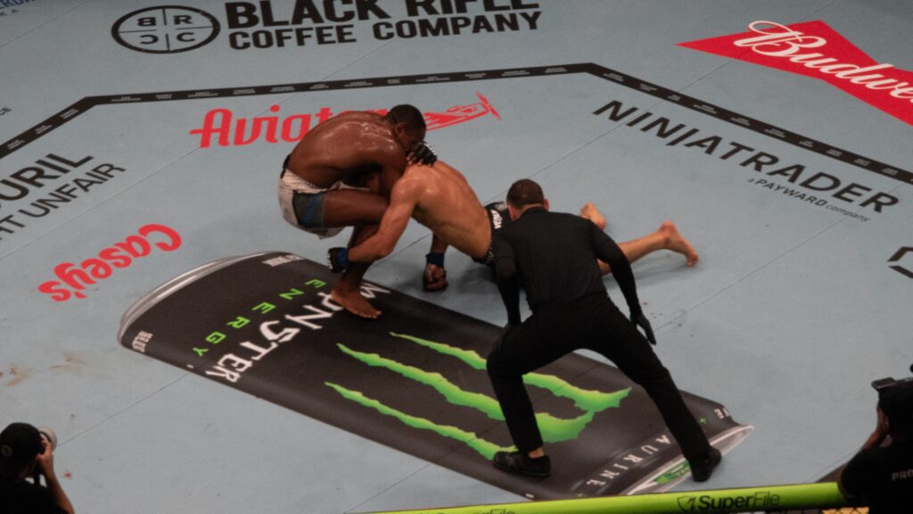 Myktybek Orolbai and Jeremiah Wells fighting