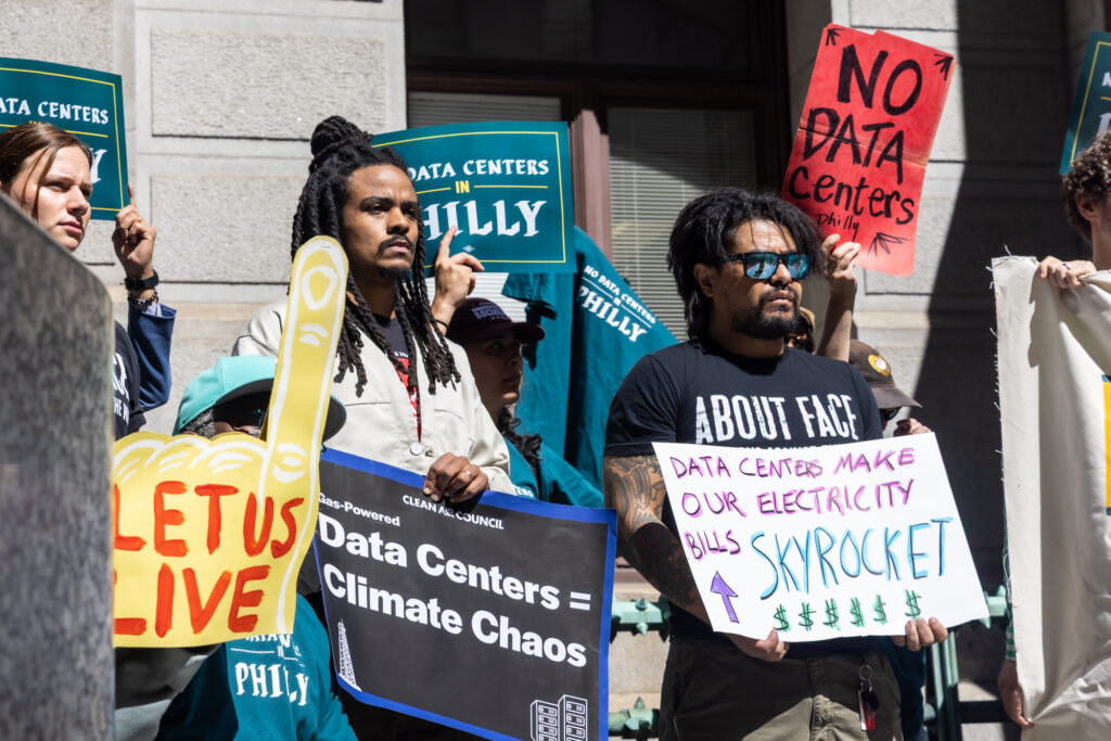 09 14 2026 k paynter no data centers in philly coalition -6 A crowd of people hold anti-data center signs