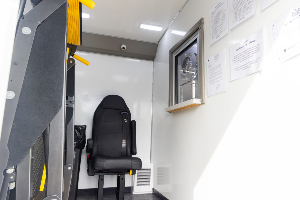 Inside the mobile unit, a desk chair where patients receive the treatment through a window.