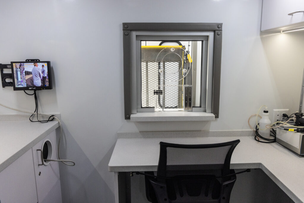 Inside the Mobile Methadone Unit there is a window through which nurses administer the methadone.