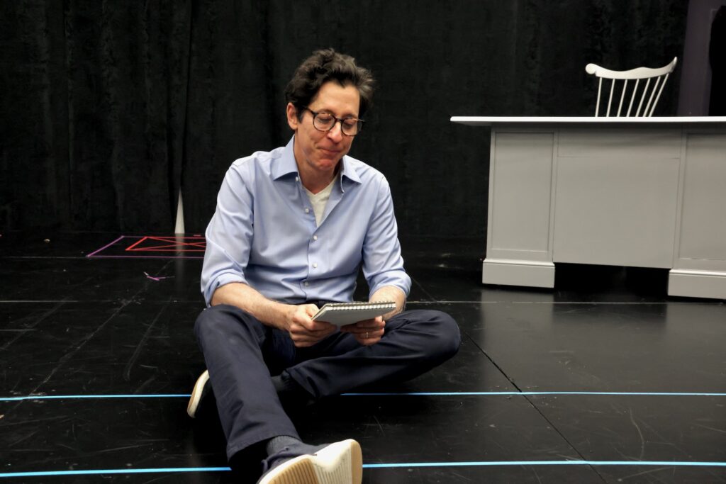 Joe Torsella on stage rehearsing his one-man show.