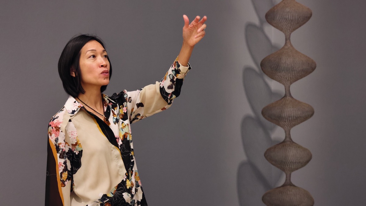Cindy Kang leading tour at art gallery