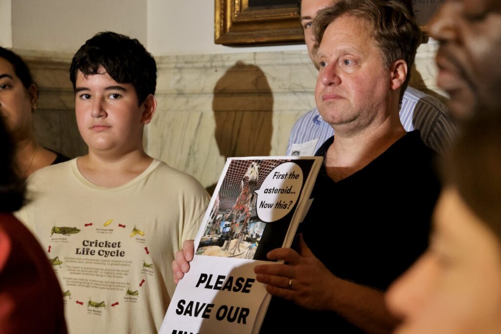 Protesters, including 12-year-old Jack Erfer (left)
